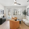 living room with a couch, chairs, and coffee table