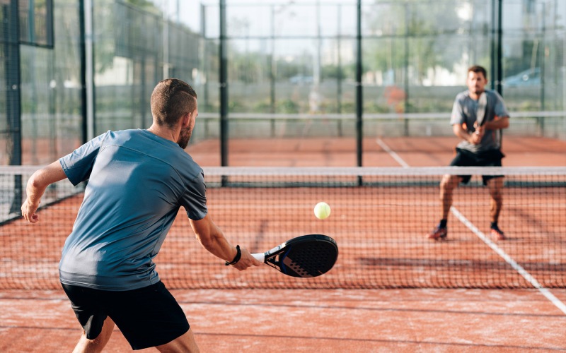 a person holding a tennis racket